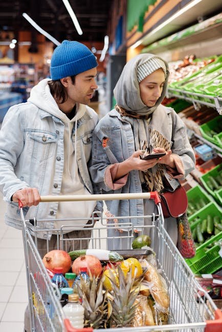 A couple in a supermarket selecting groceries